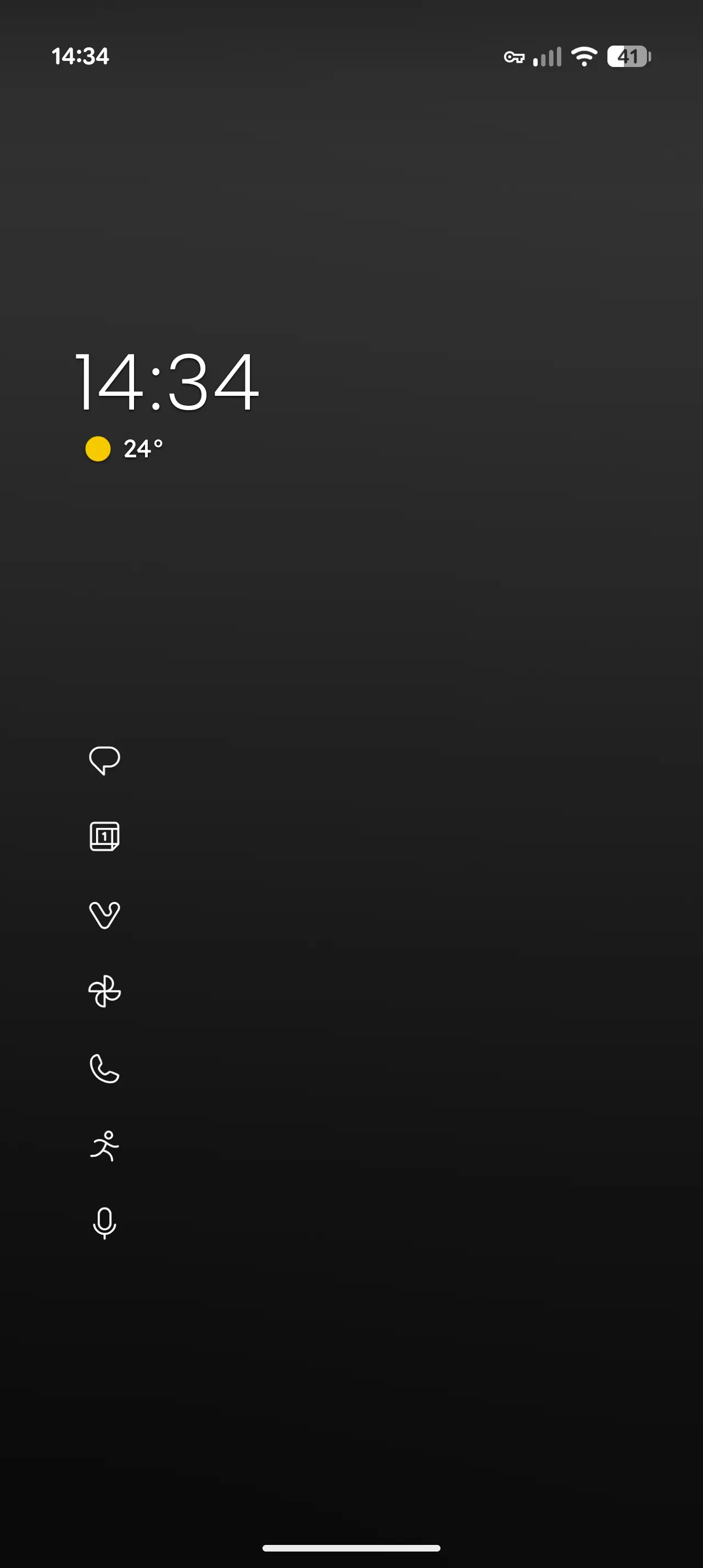An Android home screen in Niagara Launcher, dark, with a large clock, the temperature, and a column of seven small monochrome app icons without names on the left, and nothing else